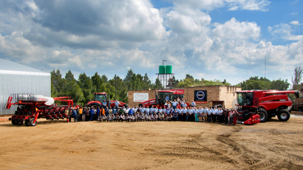 Aerial photo of Farm Cairo staff with tractors and implements.
